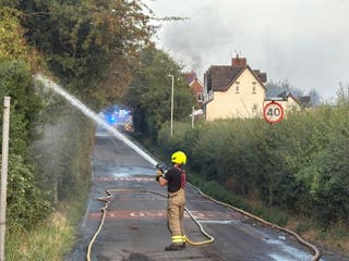 Fire crews working on Racecourse Lane, Stourbridge, where properties have been damaged by the fire
